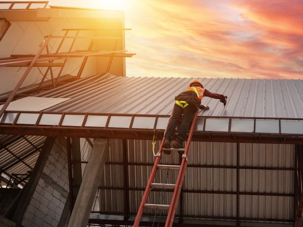 Image of Roofers Installing Metal Roof in Jacksonville FL