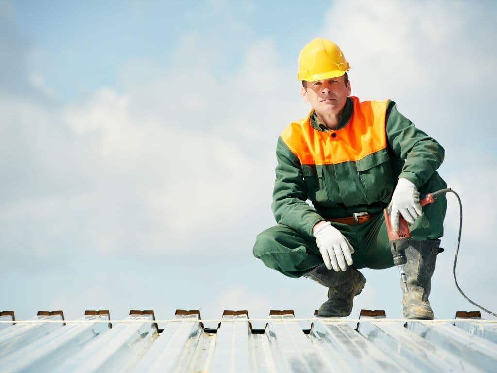 Roofer Fixating Metal Roof in Jacksonville FL